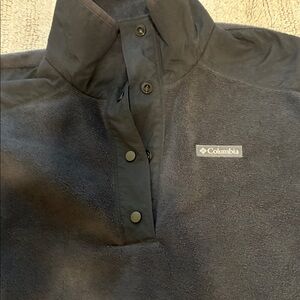 Columbia fleece quarter button up. Black , roomy , hits at the hips.